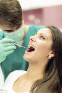 woman having teeth cleaned