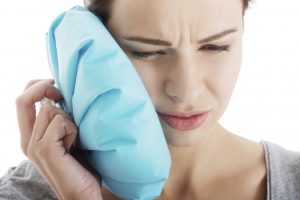 woman with dental pain can cause dental emergencies