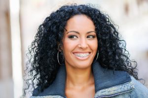 woman smiling in dental braces