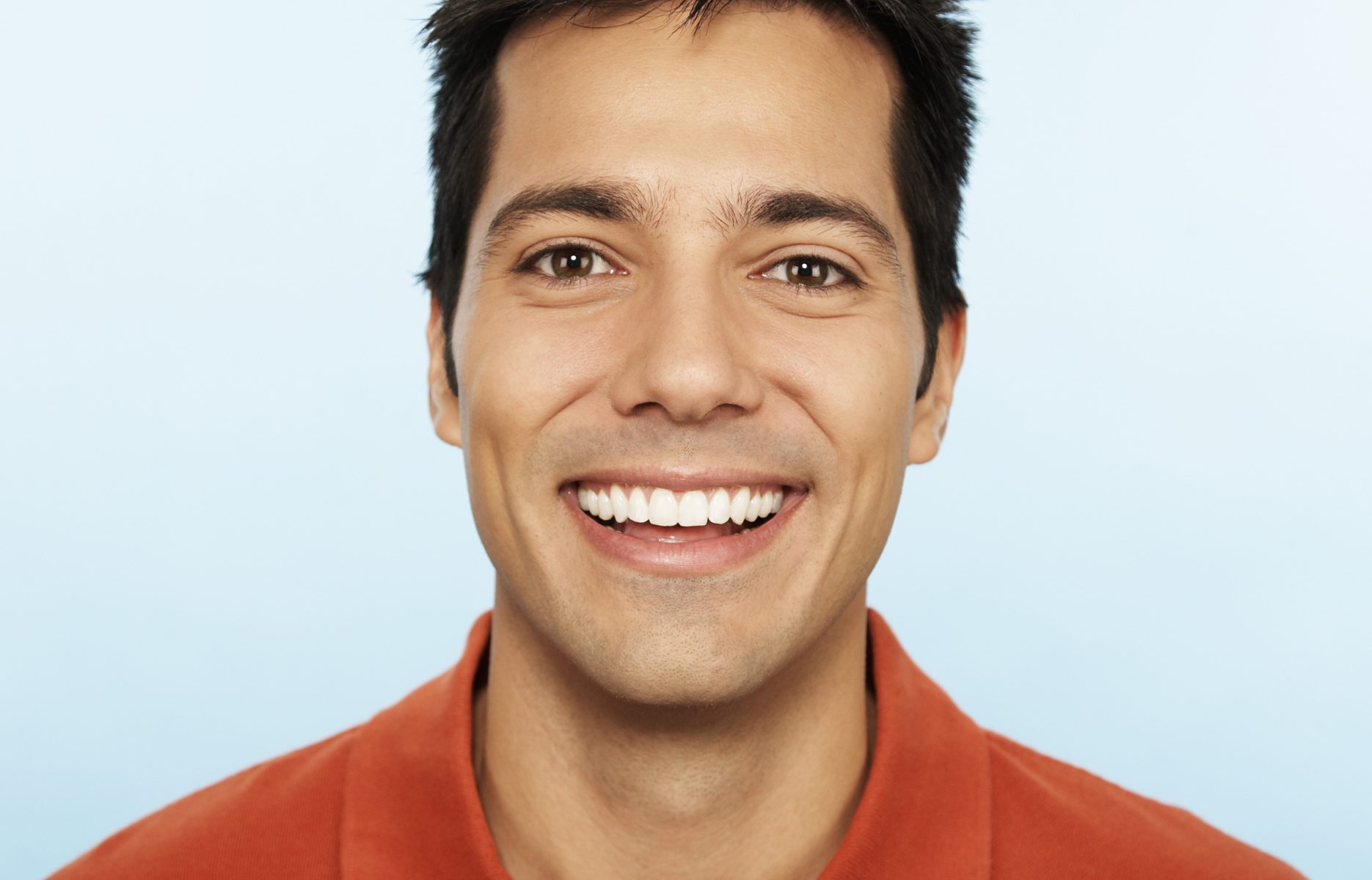 dark haired man smiling